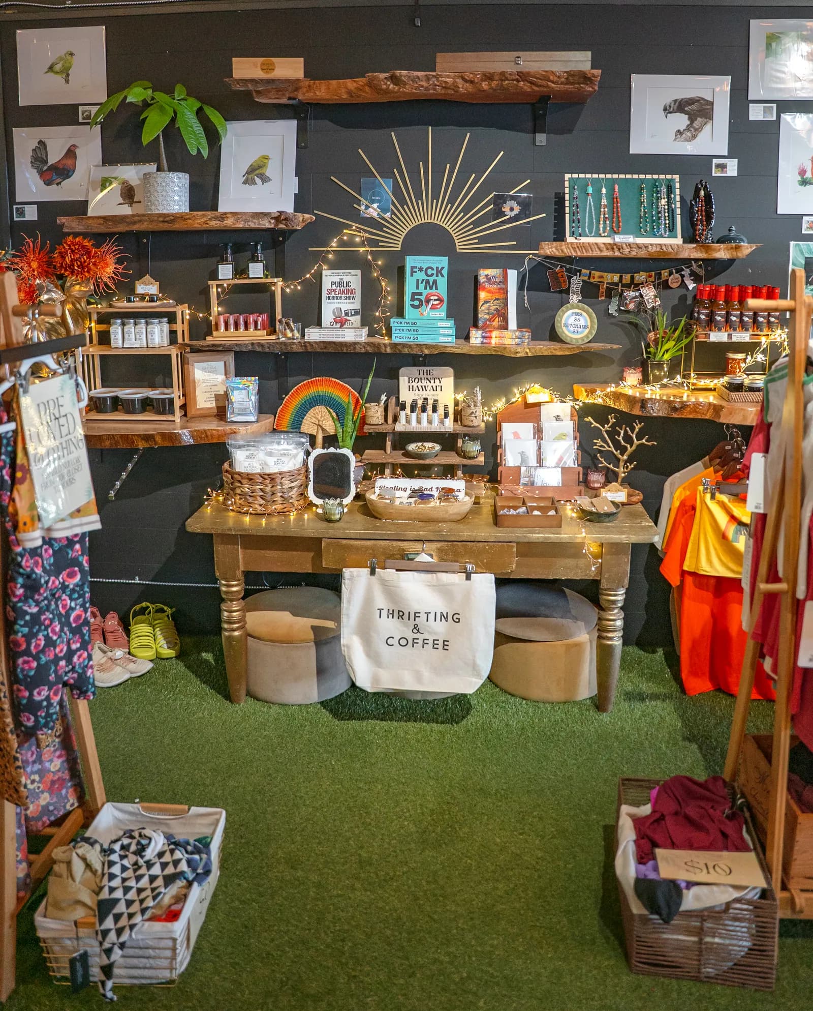 The maker's corner with local art, jewelry, house-made goods, and a curated clothing rack